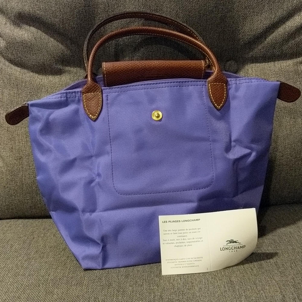 NEVER USED Small purple le pliage longchamp bag